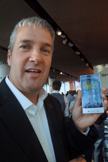 Sprint SVP David Owens with Sharp Aquos Crystal (BootCamp photo by L. Fishkin)
