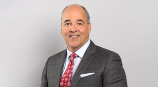 National University Chancellor Dr. Michael Cunningham