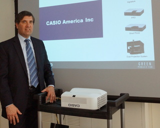 Casio's latest projector with Dir. of Product Management Joe Gillio (BootCamp photo by L. Fishkin)