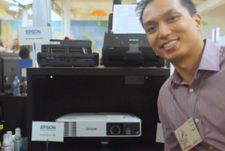 Epson's Eric Uaje with Home Cinema 1450 (Techstination photo by L. Fishkin)