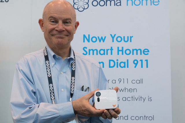 Ooma's Mike Langberg with Butterfleye camera
