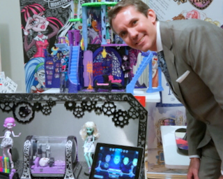 Mattel Dir. of Corporate Communications Alex Clark with Monster High Monster Maker (BootCamp photo by L. Fishkin)
