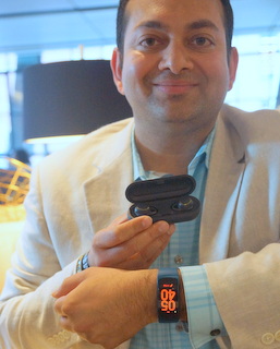 Samsung's Shoneel Kolhatkar with Gear Fit 2 and Gear IconX.  (BootCamp photo by L. Fishkin)